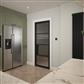 PORTLAND 4 LITE REEDED GLZ BLACK PRIMED DOOR 80x32